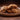 Plate of oatmeal raisin cookies on a wooden surface