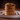 Stack of chocolate chip cookies on a plate with a dark background