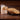 Packaged sugar cookies and a row of sugar cookies on a wooden surface